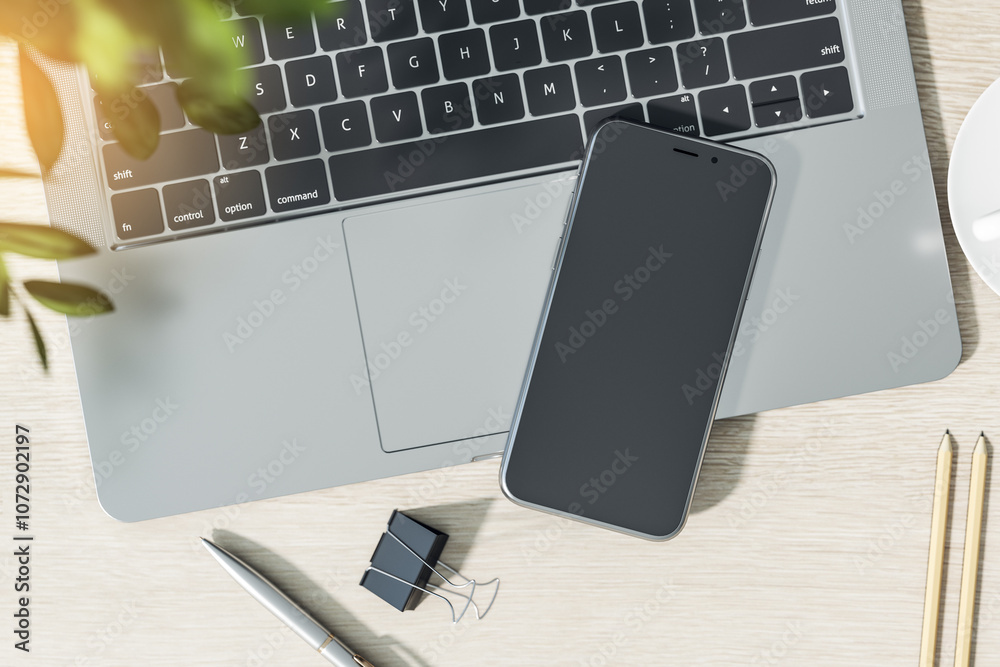 Poster Top view on blank black smartphone screen with copyspace for your text or logo on open laptop with abstract wooden background. 3D rendering, mockup