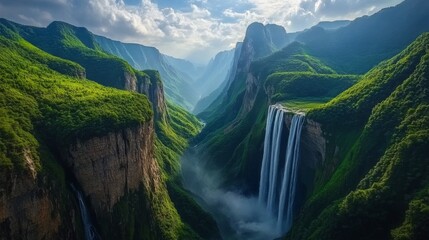 A dynamic waterfall rushing through the green valleys of the Wuling Mountains in China