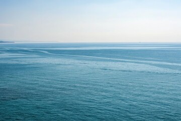 Obraz premium Vast open water with a subtle gradient of blues, wave patterns, serene ambiance, expansive horizons, underwater world, aquatic life