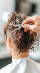 Naklejka premium Male hairdresser cutting curly hair with scissors, focused on detail