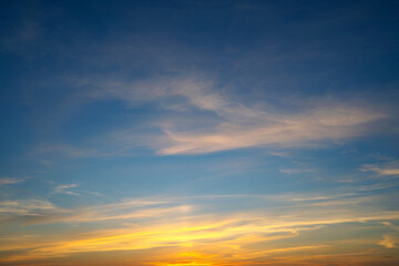 summer evening, sunset in yellow, orange and pink with clouds, background