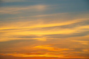 Fototapeta premium summer evening, sunset in yellow, orange and pink with clouds, background