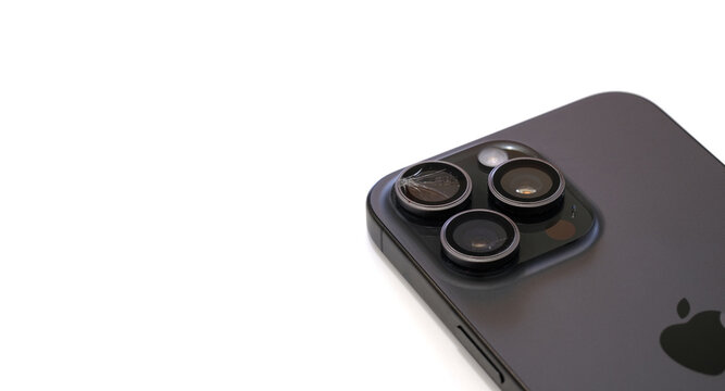 Bangkok,Thailand,11 Nov 2024 : The smartphone camera lens is broken, iphone 16 pro max close- up camera are broken and repair concepts on white background and copy space