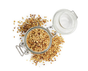 Glass jar with raw buckwheat grains on white background