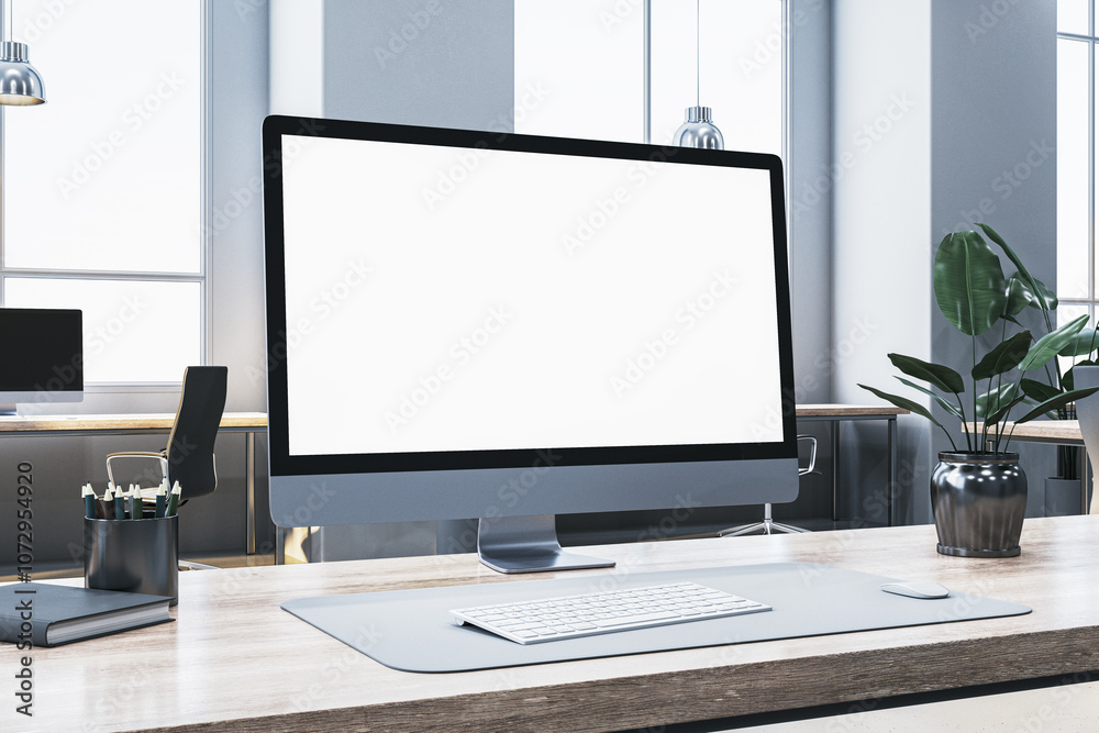 Poster modern computer screen with blank display on an office desk, clean workspace, and plants in a well-l