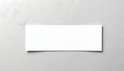 Obraz premium Empty white horizontal rectangle poster mockup with soft shadow lying diagonally on neutral light grey concrete background. Flat lay, top view isolated with white highlights, png