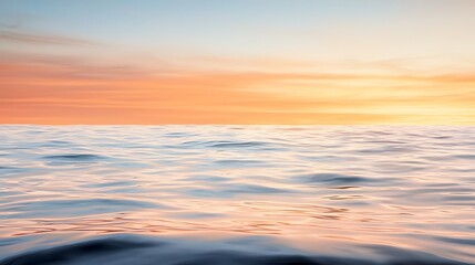 Fototapeta premium Experience the tranquility of a serene ocean at sunset with gentle waves and colorful sky
