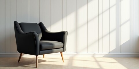 A stylish black armchair stands in a modern, well-lit room, perfect for interior design and home decor projects.