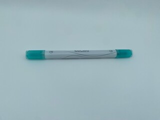 A fresh mint-green pen with a transparent body and elegant wave pattern design, showcasing minimalist and stylish stationery aesthetics.