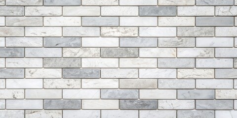 Obraz premium A close-up view of a white and gray brick wall, featuring subtle variations in texture and color.