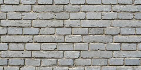 Obraz premium A close-up view of a weathered brick wall, showcasing the intricate texture of each brick and the subtle variations in color and shape.