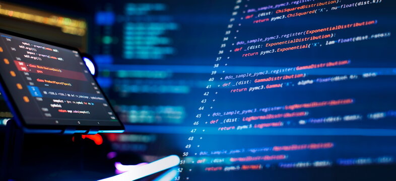 Writing programming code on laptop. Software source code. Programming code. Abstract IT technology background.