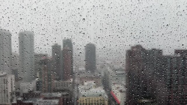 Vg view of a rainy cityscape through the window, showcasing urban beauty