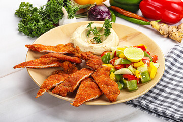 Slices pork schnitzel with vegetables