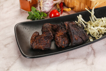 Grilled beef barbecue served onion