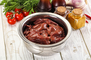 Raw chicken liver uncooked in the bowl