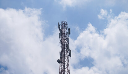 Transmitter tower with blue sky and clouds background