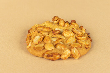 Crunchy Peanut Cookie on Beige Background - Perfect for Snack, Dessert, and Culinary Themes