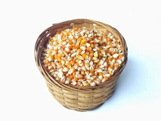 Dry grain corn in basket isolated on white background 