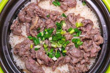 top view clay pot rice with beef at horizontal composition