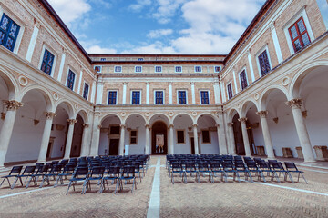 Architectural beauty of Palazzo Ducale in Urbino under a stunning blue sky. Urbino, Marche, Italy