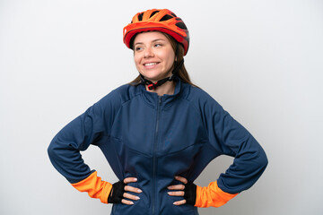 Young cyclist Lithuanian woman isolated on white background posing with arms at hip and smiling