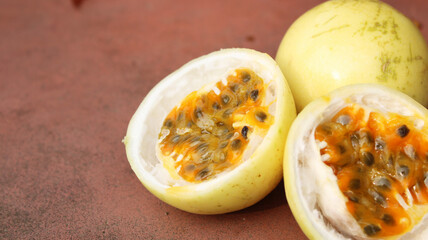 Fresh Passion Fruit  Halves Showing Seeds and Vibrant Pulp – High-Quality Close-Up Image with copy space