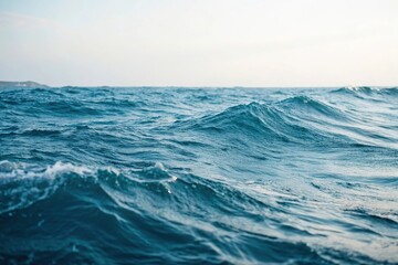 Fototapeta premium Soft abstract blue sea waves gently flowing, wavy patterns, serene landscape, blue ocean background