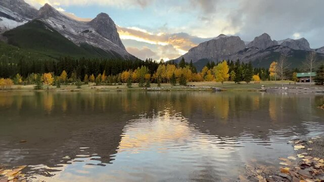 Pan View of Quarry Lake with Reflection of Mountains in Water at Sunset in Autumn
