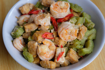 Close up of stir fried shrimps with tempeh and bitter gourd.