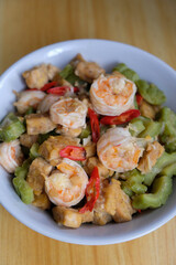 Close up of stir fried shrimps with tempeh and bitter gourd.