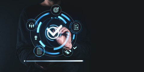 Obraz premium Person interacting with holographic interface, highlighting a digital checkbox on dark background. Concept of project approval and quality