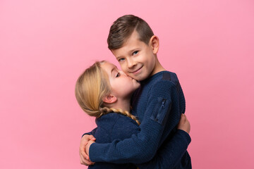 Cute brothers over isolated pink background