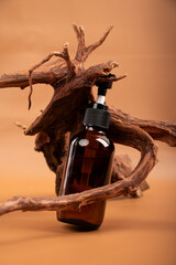 Amber Glass Pump Bottle with Rustic Driftwood on Warm Background