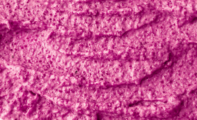 Purple berry yogurt ice cream. Fresh fruit and berry smoothie currant, pitaya, fig, grape, plum. Ice cream texture. Delicious sweet dessert close-up as background.
