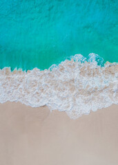 Aerial view of beach and sea with blue water waves. Beautiful natural summer vacation holidays