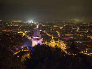 Obraz premium High Angle View Of Illuminated Cityscape Against Sky At Night, Graz, Austria