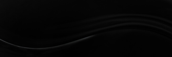 Black gray satin dark fabric texture luxurious shiny that is abstract silk cloth background with patterns soft waves blur beautiful.