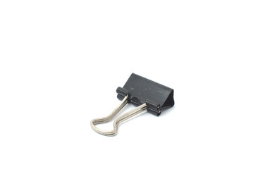 Close-Up of Binder Clip. A close-up view of a single binder clip lying on its side with handles extended.