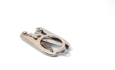 Closed scissors in a folded, compact form on a white background.