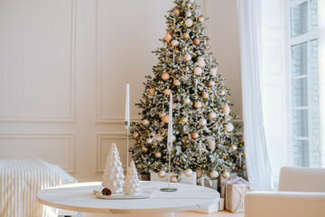 Elegant winter living room with a decorated Christmas tree and cozy decor