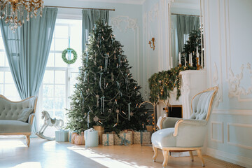 Elegant living room with a beautifully decorated Christmas tree and gifts