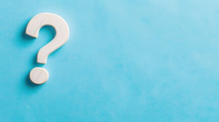 White Question Mark on Blue Background - a clear and thought-provoking visual. The white question mark stands out boldly against the blue backdrop, inviting curiosity and inquiry.