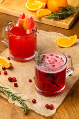 Hot drinks from fruits and berries, mulled wine, beautiful serving in a cafe, restaurant, rustic.