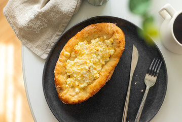 traditional Georgian cuisine.  Open pie with mozzarella cheese. Ajara khachapuri