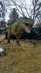 model of a dinosaur in a city park