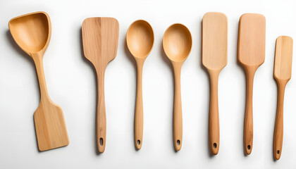 Wooden kitchen utensils arranged in a row on a light background
