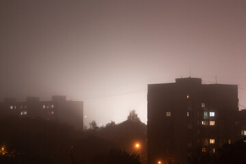 Fog in the night city after rain. Image taken on drone. Kaliningrad city, Russia