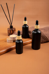 Elegant Amber Dropper Bottle with Candles and Rustic Decor for Spa and Wellness Setting