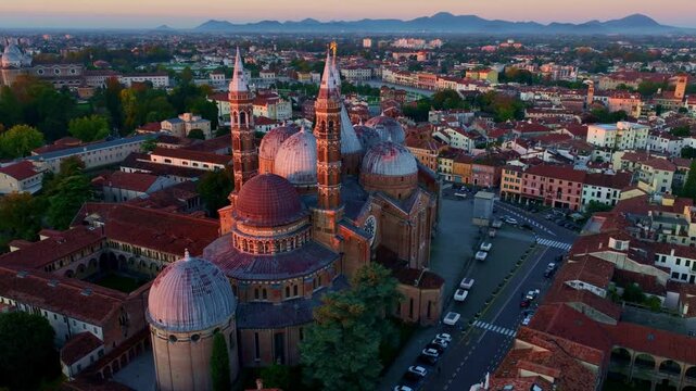 orbiting drone shot of Basilica of Saint Anthony of Padua in morning light, establishing drone shot of the medieval Italian city of Padova, tourism in Veneto, Italy